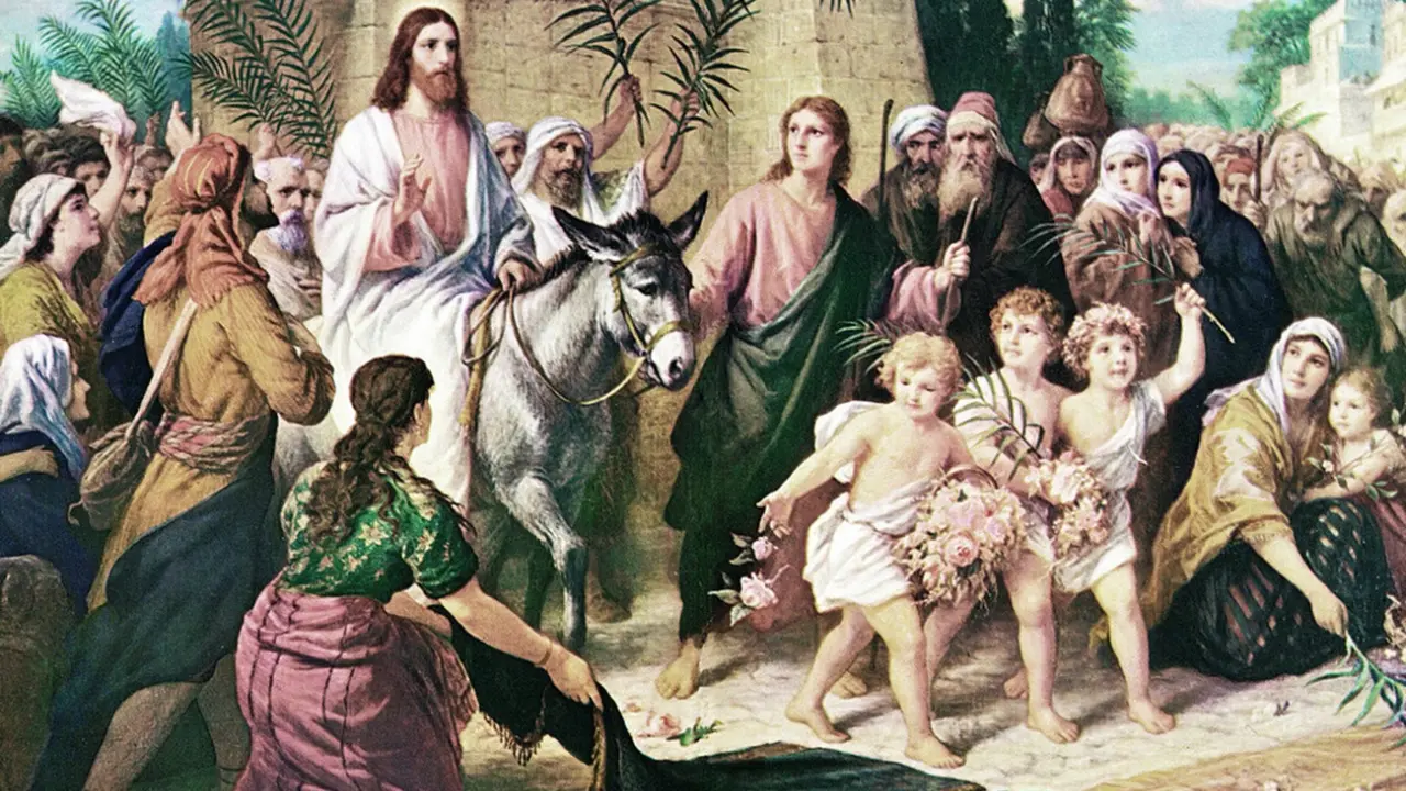 La imagen muestra a Jesús entrando a Jerusalen.