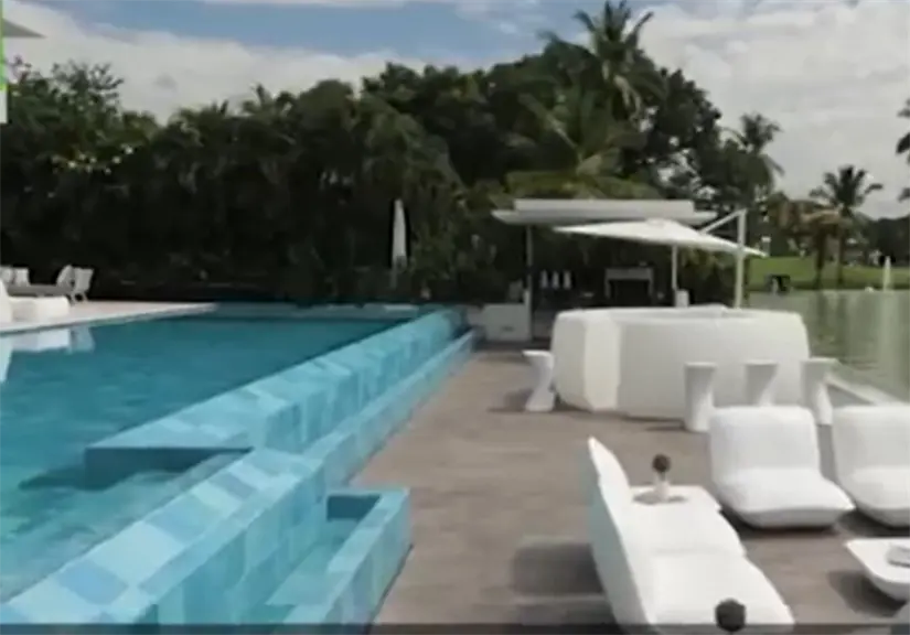 La propiedad cuenta con una amplia piscina rodeada de jardines y áreas de descanso.