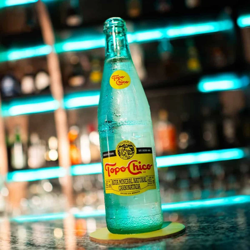 Topo Chico actualmente pertenece a The Coca-Cola Company, lo que ha sido clave en su expansión internacional.